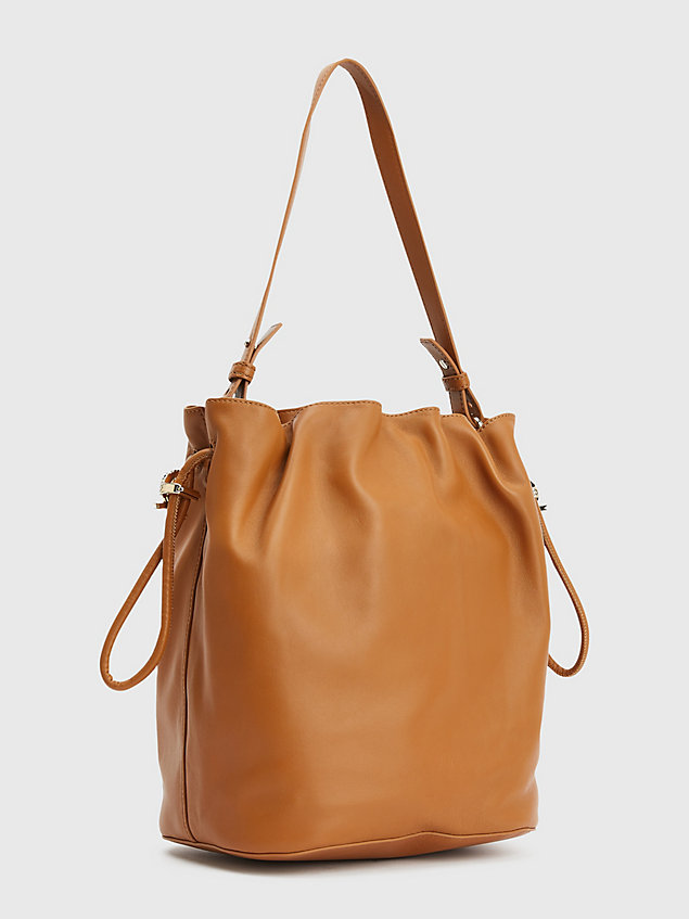 beige luxe leather bucket bag for women tommy hilfiger