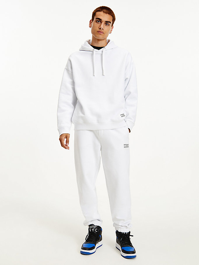 white tommy badge relaxed joggers for men tommy jeans