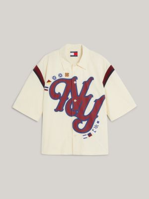 chemise college à manches courtes et logo ny jaune pour hommes tommy jeans