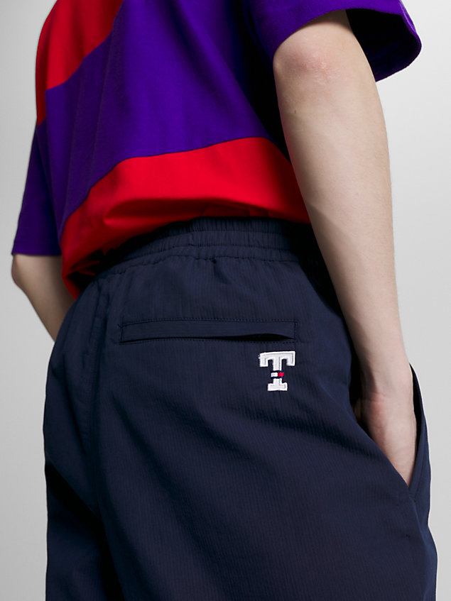blue letterman wind-pant trousers for men tommy jeans