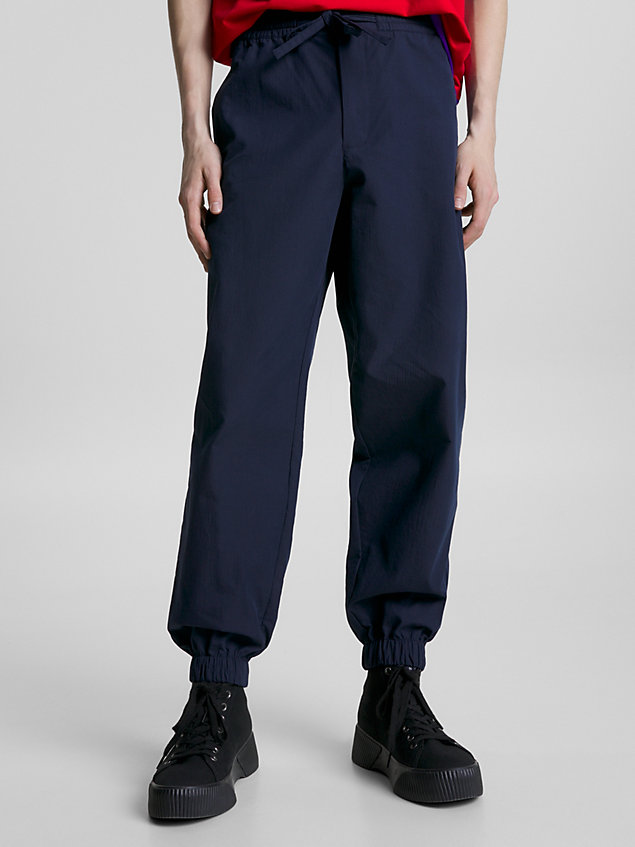 blue college-windhose für herren - tommy jeans