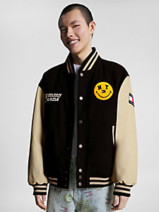 black tommy jeans x smiley® two-tone varsity jacket for men tommy jeans
