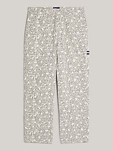 white tommy x keith haring dancing man print skater trousers for men tommy jeans