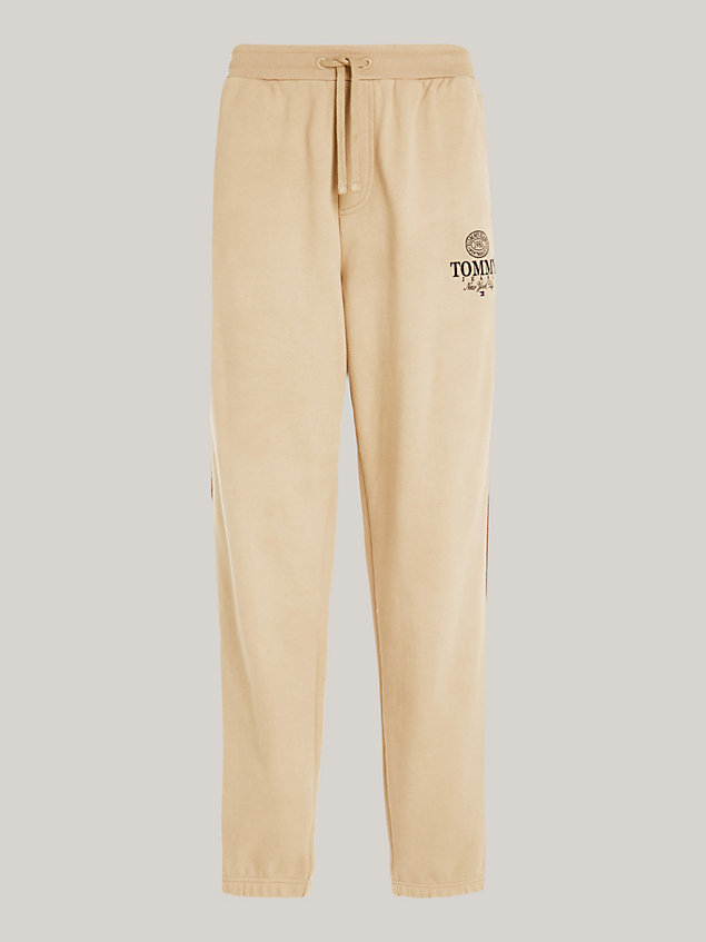 beige relaxed logo joggers for men tommy jeans