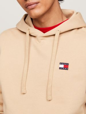 beige tommy badge drawstring hoody for men tommy jeans