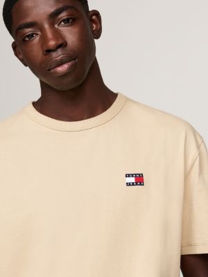 beige tommy badge crew neck t-shirt for men tommy jeans