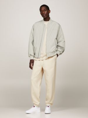 beige relaxed fit jogginghose mit logo für herren - tommy jeans