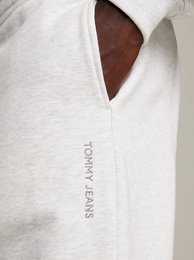 grey joggery o luźnym kroju z logo dla mężczyźni - tommy jeans