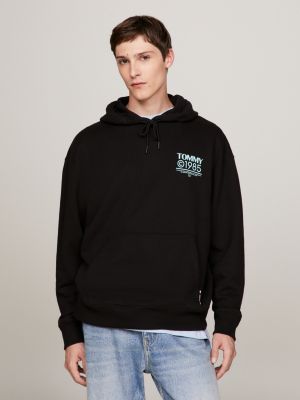 Sudadera negra de corte estándar con capucha y logo de estilo universitario  de camuflaje de Tommy Jeans