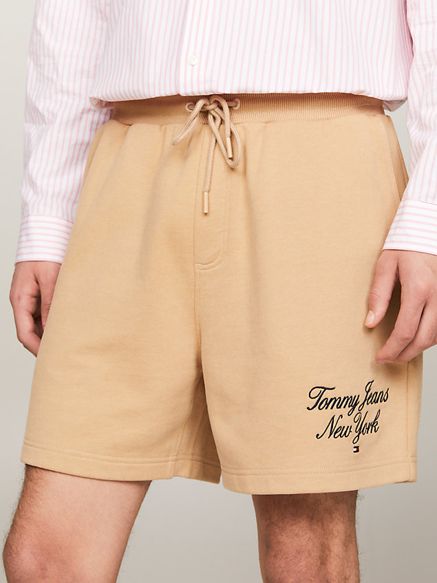 beige prep script logo beach shorts for men tommy jeans