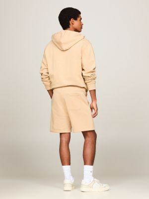 beige tommy badge sweat shorts for men tommy jeans