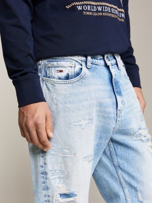 vaqueros isaac amplios, cónicos, desgastados y desteñidos azul de hombres tommy jeans