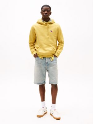 yellow tommy badge hoody for men tommy jeans