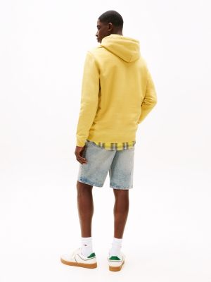 yellow tommy badge hoody for men tommy jeans