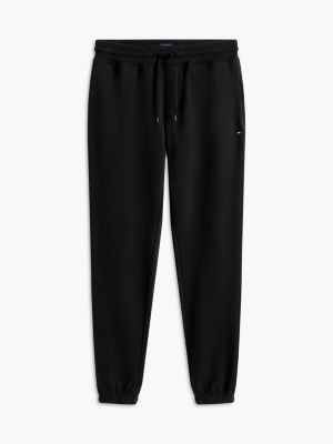 joggers de felpa con cordón y logo negro de hombres tommy jeans