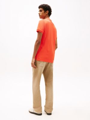 orange slim fit poloshirt mit flag-patch für herren - tommy jeans