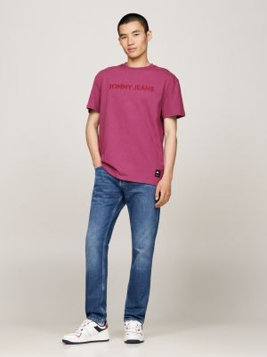 t-shirt tinta in capo con logo ricamato rosa da uomini tommy jeans