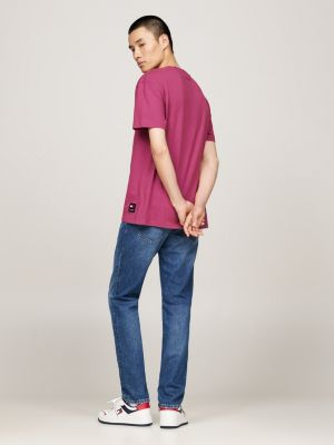 t-shirt tinta in capo con logo ricamato rosa da uomini tommy jeans