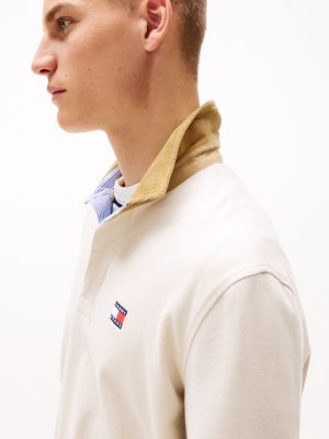 beige oversized rugbyshirt met tommy-badge voor heren - tommy jeans