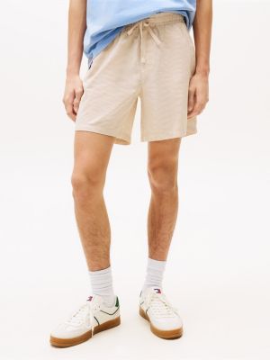 beige gestreifte loose fit seersucker-shorts für herren - tommy jeans