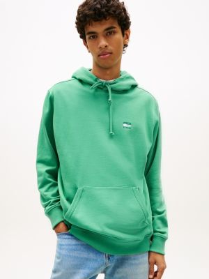 sweat à capuche tommy badge en tissu éponge green pour hommes tommy jeans