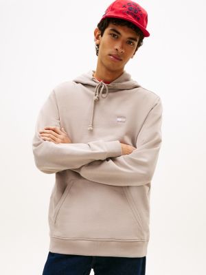 sweat à capuche tommy badge en tissu éponge grey pour hommes tommy jeans