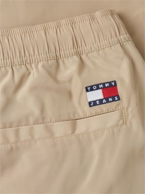 beige jaimie relaxed global stripe tape trousers for men tommy jeans