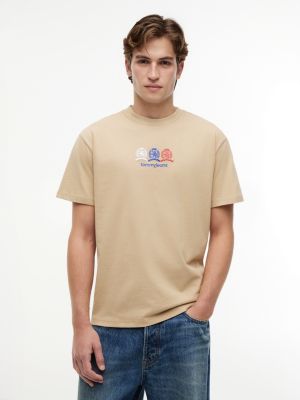 t-shirt relaxed fit con logo stemma sul retro beige da uomini tommy jeans