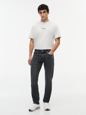  schwarze scanton slim jeans mit fade-effekt für herren - tommy jeans