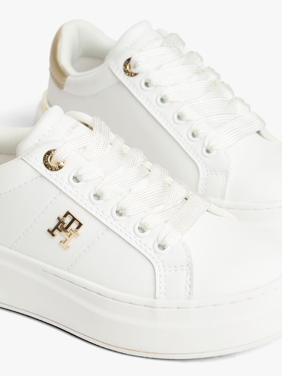 TH Monogram Metallic Heel Platform Trainers — White