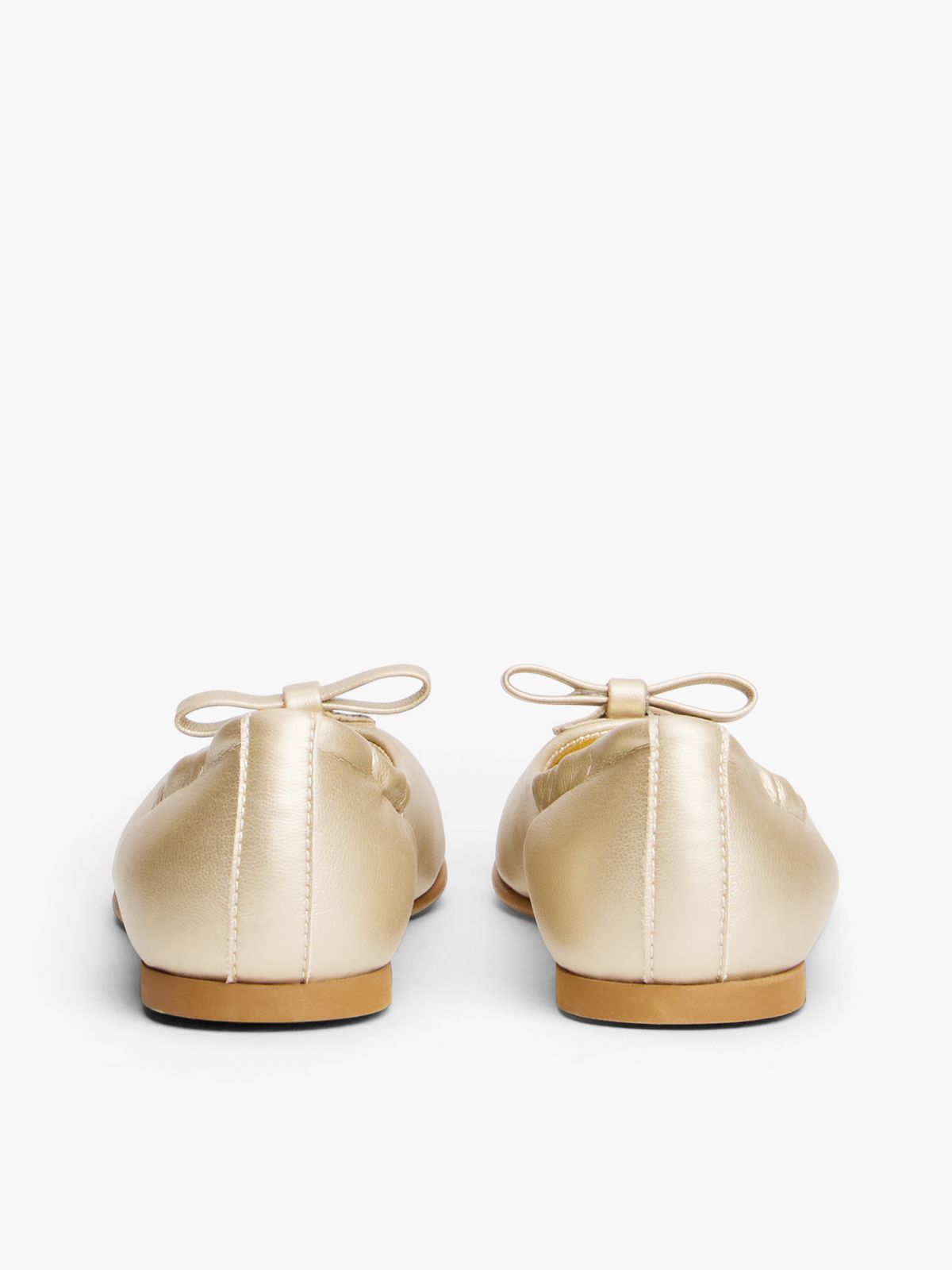 TH Monogram Bow Ballerinas — Gold