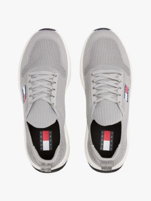 multi logo embossed knit trainers for men tommy jeans