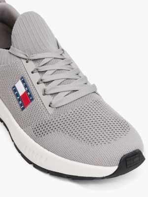 multi logo embossed knit trainers for men tommy jeans