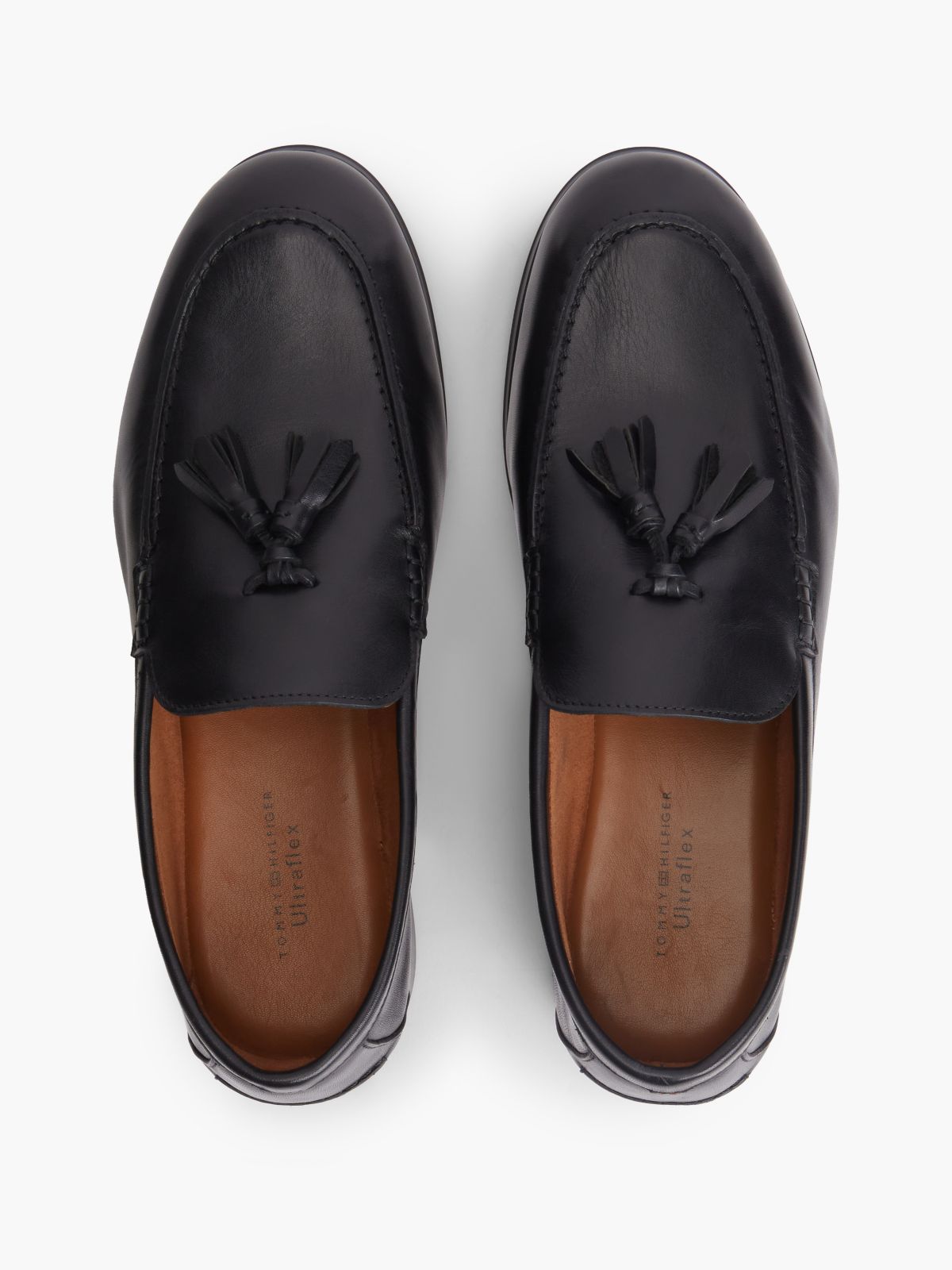 Logo Tassel Flexible Leather Loafers — Black