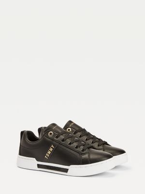 black and gold trainers