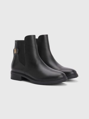 monogram plaque long leather boots