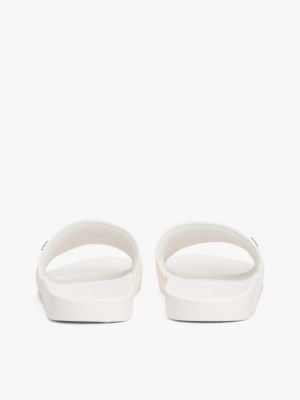 white embossed th monogram pool slides for women tommy hilfiger