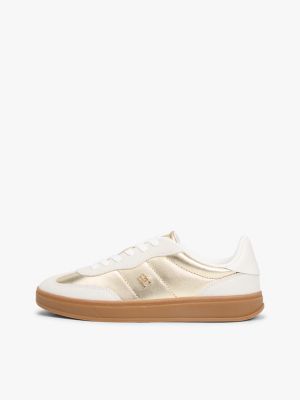 gold th monogram metallic leather trainers for women tommy hilfiger