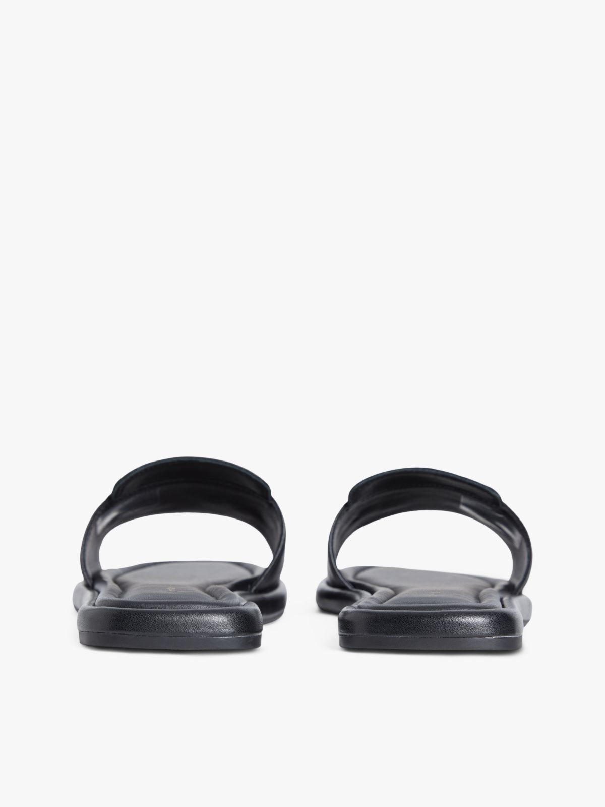 TH Monogram Horsebit Flat Leather Mules — Black