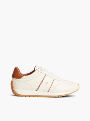 beige leather rubberised th monogram trainers for women tommy hilfiger