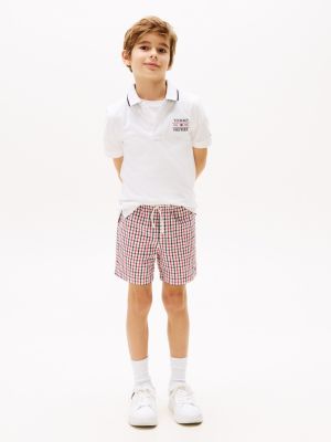 polo con logo ricamato bianco da bambini tommy hilfiger