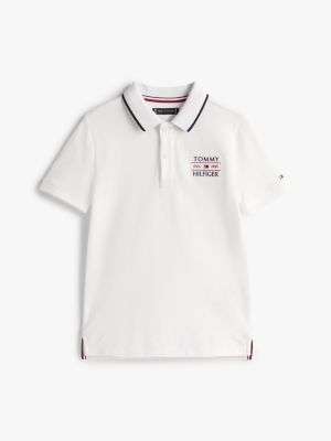 polo con logo ricamato bianco da bambini tommy hilfiger