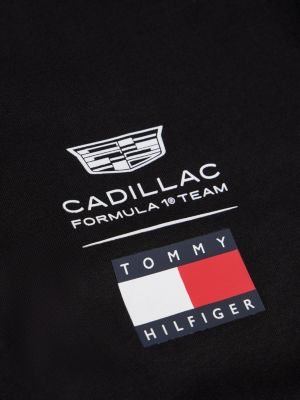 black th x cadillac formula 1® team logo t-shirt for adults gender inclusive tommy hilfiger