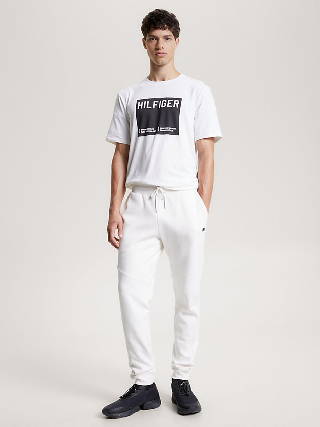 white sport essential tonal logo cuffed joggers for men tommy hilfiger