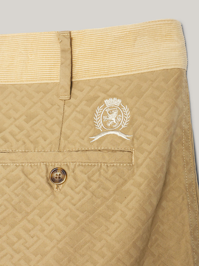 beige crest th monogram relaxed fit chinos for men tommy hilfiger