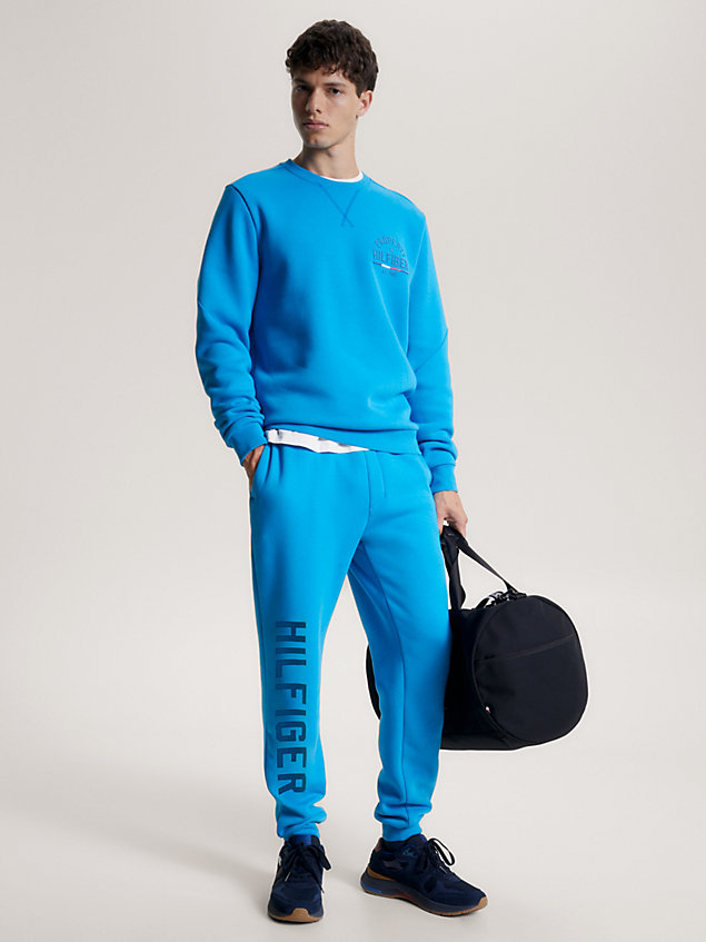 blue sport jogginghose mit bündchen und grafik-logo für herren - tommy hilfiger