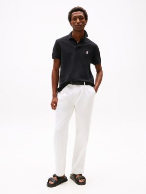 polo con monograma th a contraste negro de hombres tommy hilfiger