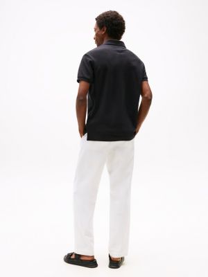 polo con monograma th a contraste negro de hombres tommy hilfiger