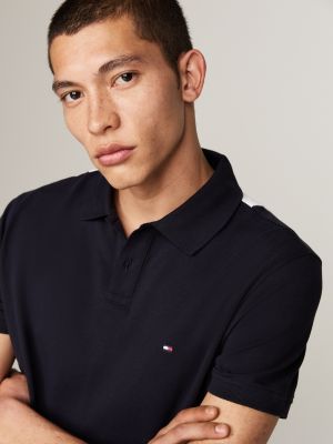 polo de corte regular con diseño color block negro de hombres tommy hilfiger