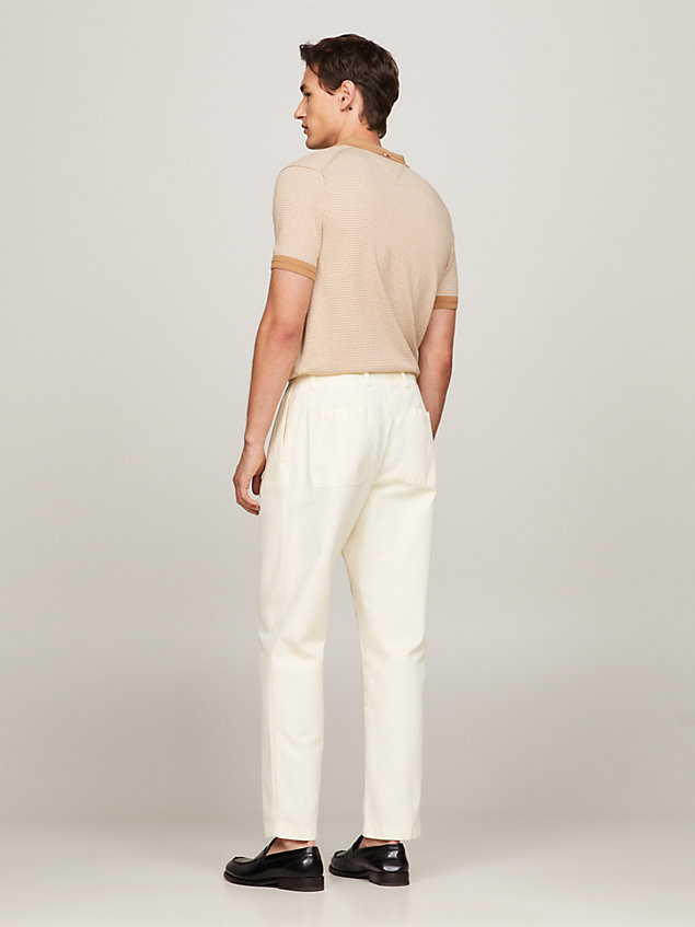 beige pleated garment dyed tapered fit chinos for men tommy hilfiger